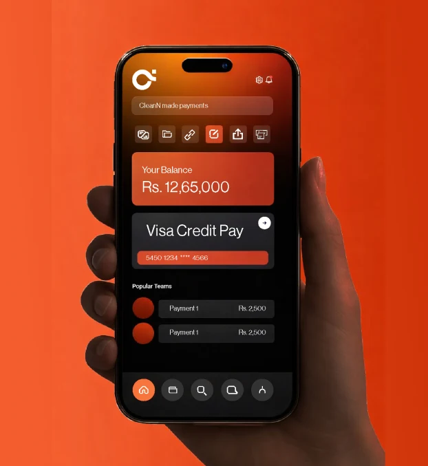 A hand holding a phone with an orange payments app